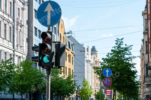 Preview: traffic semaphore with green light on the background of defocused urban street