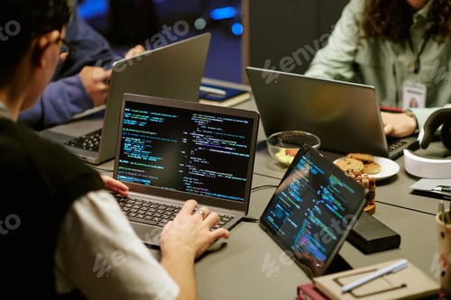 Preview: Young Adult Men and Women Collaborating on Software Development Project Indoors