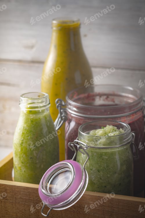 Preview: Jars with different smoothies in the wooden box vertical
