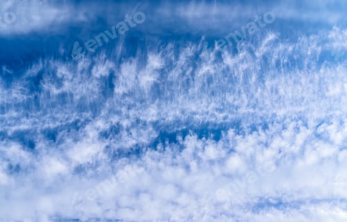 Preview: Beautiful and calming cirrus cloud formations in a deep blue summer sky