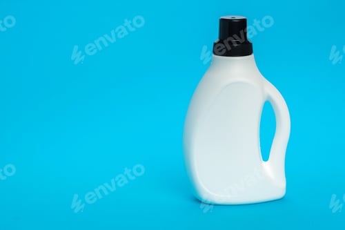 Preview: Cleaning liquid container on blue background in simple design and focus