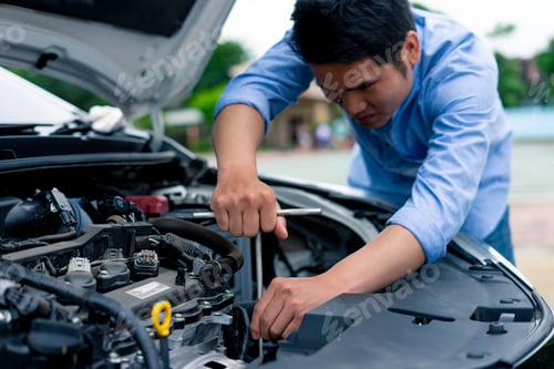 Preview: The male mechanic's hand holds the wrench In order to fix And check car engine, engineer concept and