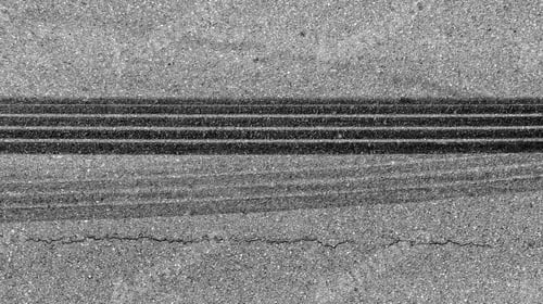 Preview: Aerial view tire track mark on asphalt tarmac road race track texture and background.