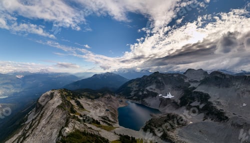 Preview: Breathtaking Mountain Lake Overlook in British Columbia With Dramatic Clouds and Rugged Peaks