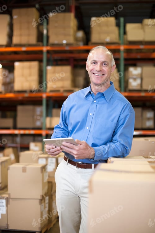 Preview: Portrait of female warehouse worker with digital tablet