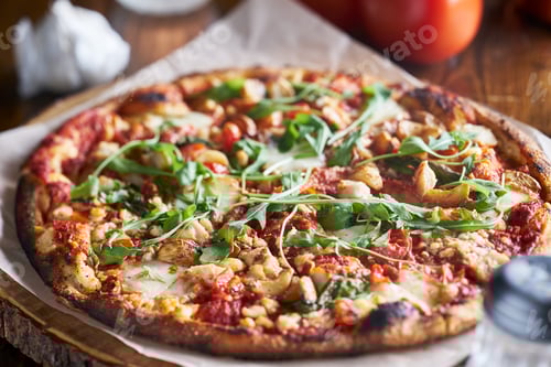 Preview: rustic wood fired pizza with roasted garlic and arugula