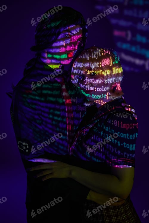 Preview: modern couple in colorful neon programming symbols projection on blue backdrop, cosplay concept