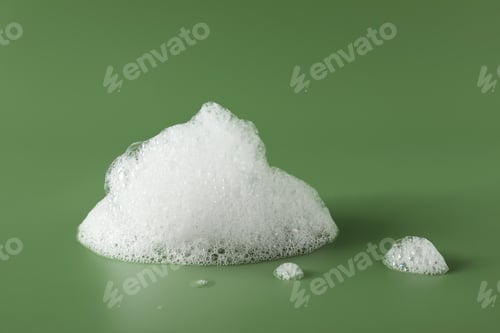 Preview: Drop of fluffy bath foam on olive background