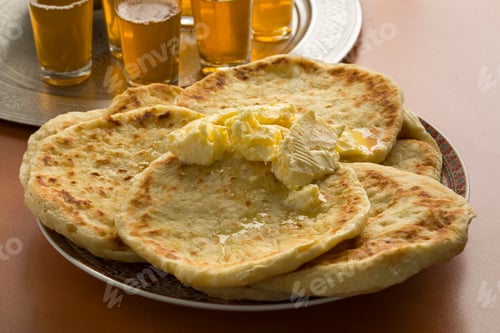 Preview: Dish with traditional Moroccan meloui pancakes topped with butte