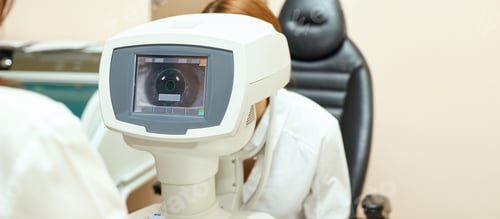 Preview: ophthalmologist doctor in exam optician laboratory with female patient. Eye care