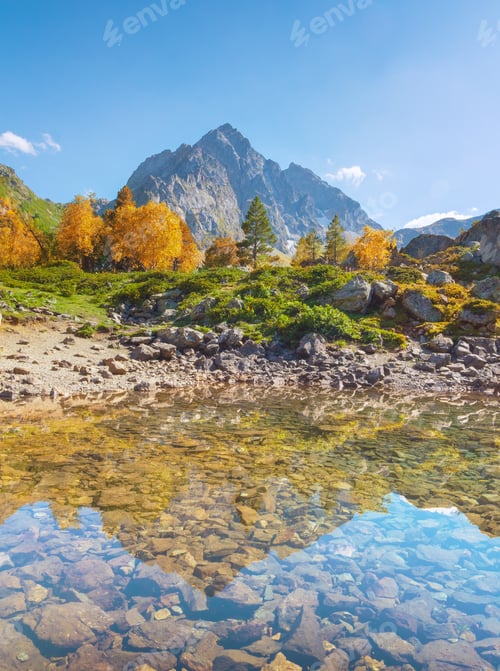 Preview: Sunny autumn day abd beautiful mountain lake.