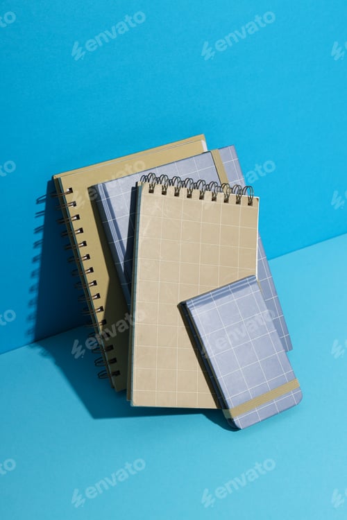 Preview: Different notebooks stand on a blue background