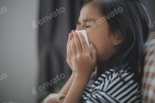 Preview: Sick Asian girls have high fevers and flu and sneeze into tissues in bed in the bedroom,