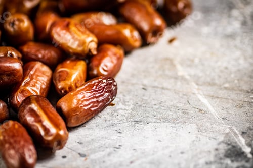 Preview: A pile of ripe dates on the table.