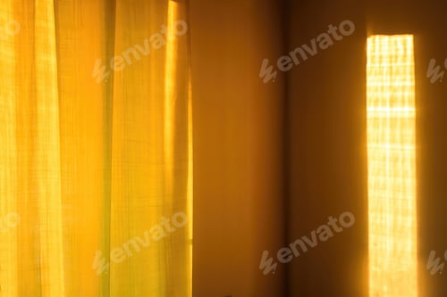 Preview: Sunbeam on yellow wall of house. Surface texture with sun glare.