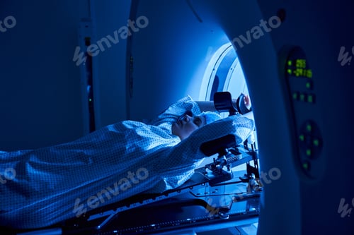 Preview: Patient undergoing MRI scan in a modern hospital room with ambient blue lighting