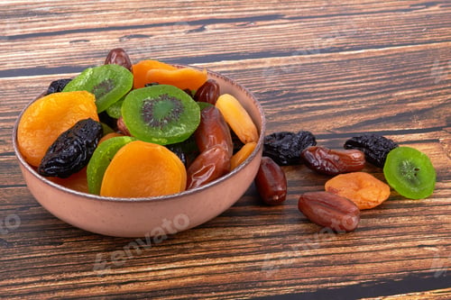 Preview: Bowl of Assorted Dried Fruits on Wooden Table