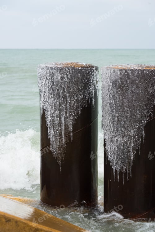 Preview: Frozen Water On A Metal Pipes Coming From The Lake