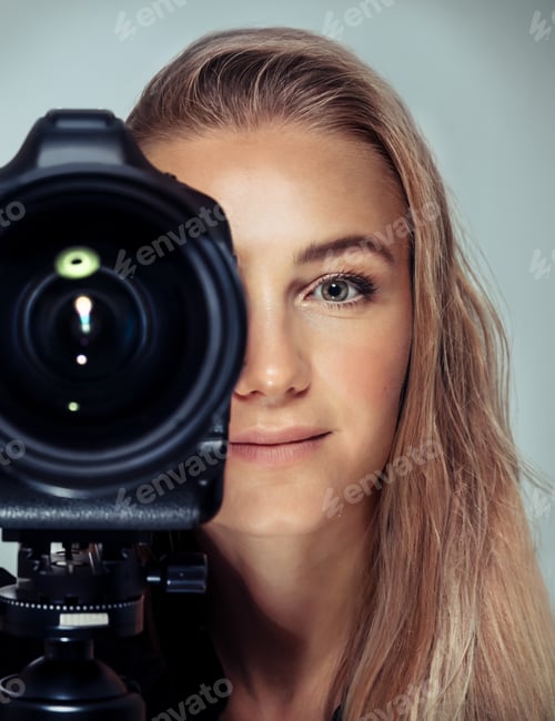 Preview: Beautiful woman with camera