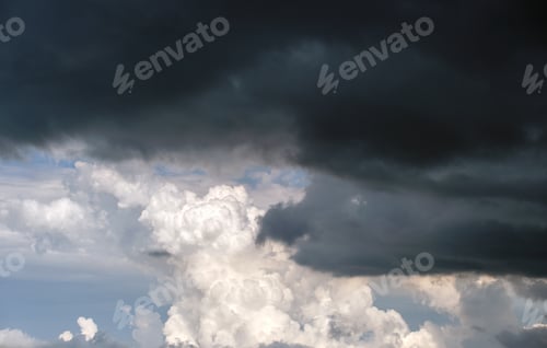 Preview: Landscape of dark ominous clouds forming on stormy sky during heavy thunderstorm