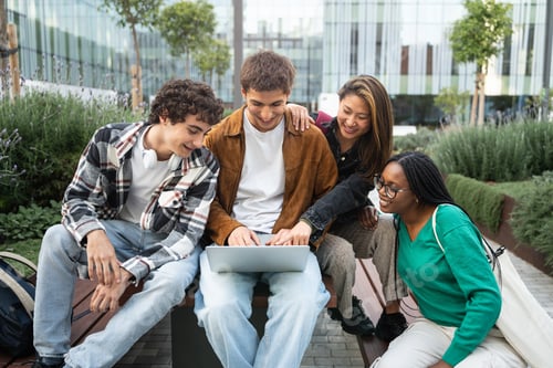Preview: Group of university students using laptop working and learning together