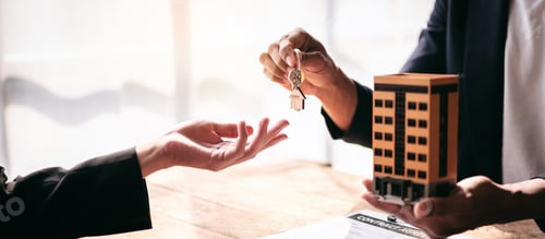 Preview: A man is handing a key to a woman