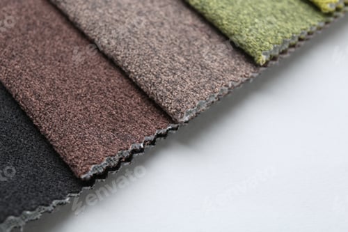 Preview: Samples of different fabrics on white background, closeup. Space for text
