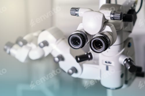 Preview: Surgical microscope in operating room with doctors. Ophthalmological clinic.