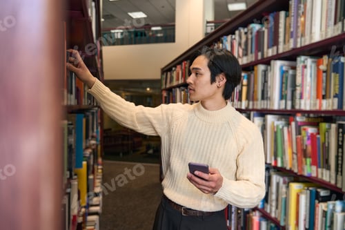 Preview: Portrait of smart asian university student searching book in modern library, education concept