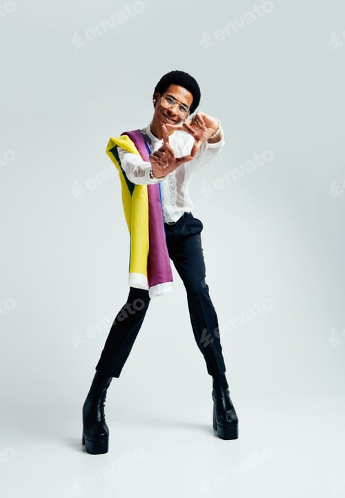 Preview: Fashionable fluid gender man posing in studio