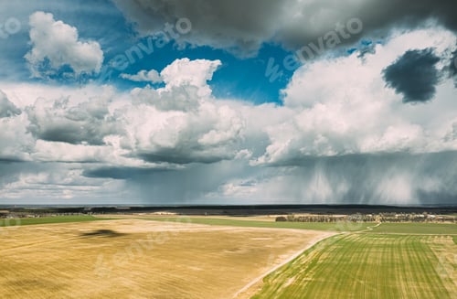 Preview: Aerial View. Amazing Natural Dramatic Sky With Rain Clouds Above Countryside Rural Field Landscape