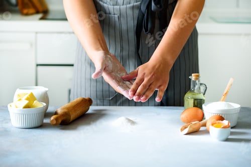 Preview: Female hands kneading dough, baking background. Cooking ingredients - eggs, flour, sugar, butter