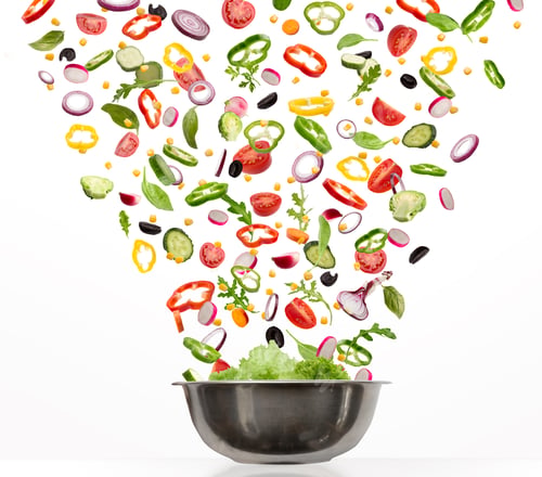 Preview: Fresh vegetables flying into steel pot, isolated on white background