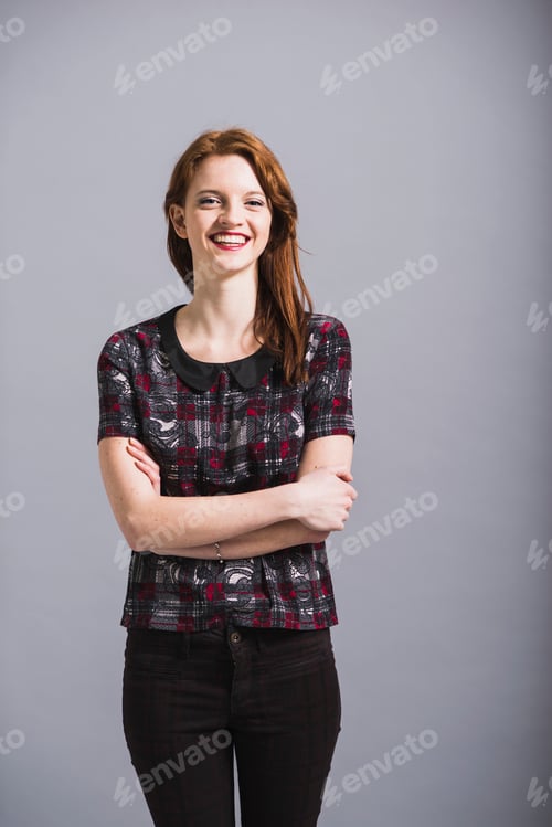 Preview: Portrait of happy young woman wearing pants and top