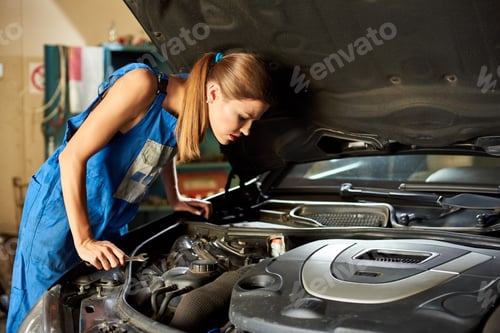Preview: Girl tries to repair the car and looks under its hood