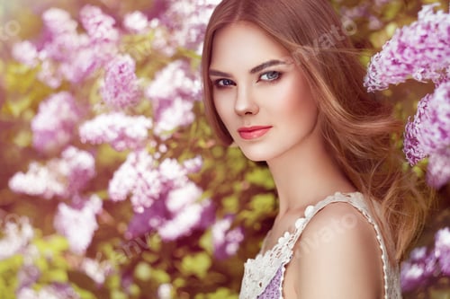 Preview: Beautiful woman with flowers of lilac