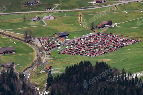 Preview: the aerial view of a village is shown in a rural setting