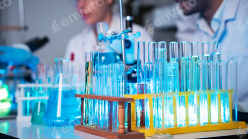 Preview: A group of young scientists are conducting experiments in the lab using a microscope.