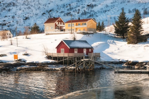 Preview: Scandinavian red house with wooden jetty on coastline