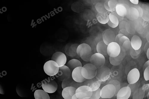 Preview: silver shiny bokeh on black background for holiday