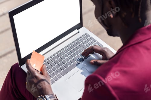 Preview: man paying with credit card an online purchase