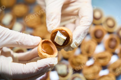 Preview: Close-up female hands preparing sweet nuts dessert, homemade bakery