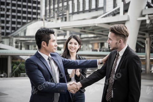 Preview: Business partner work hands shaking while looking at successful work at tablet. Business concept.