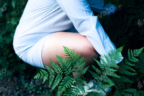 Preview: hipster woman with fern leaf embracing. girl with natural herb.