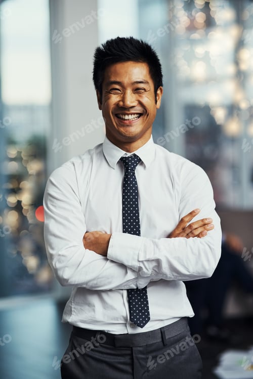Preview: Invest in your future daily. Portrait of a well-dressed businessman standing in a office.