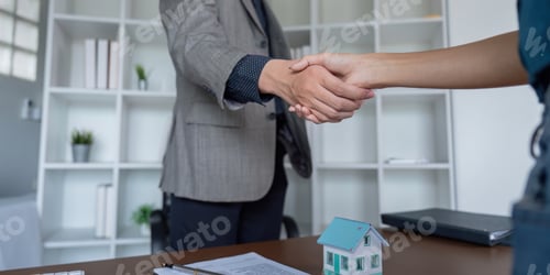 Preview: Business Deal Handshake in Real Estate Office for Property Sale Agreement