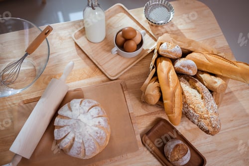 Preview: Fresh homemade bread on a table in the kitchen. Bakery baker bread