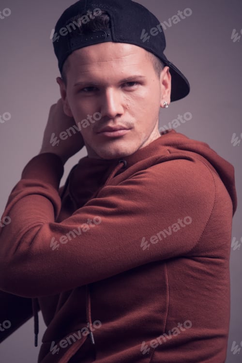 Preview: One Young Man, Early 20S, Boyish Looks, Posing In Studio, Casual Clothes, Sweatshirt Cap, Upper