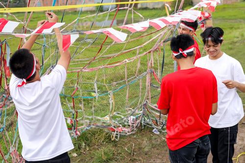Preview: Group Of Indonesian Young Men Work Together To Set Up Decorations For Traditional Independence Day