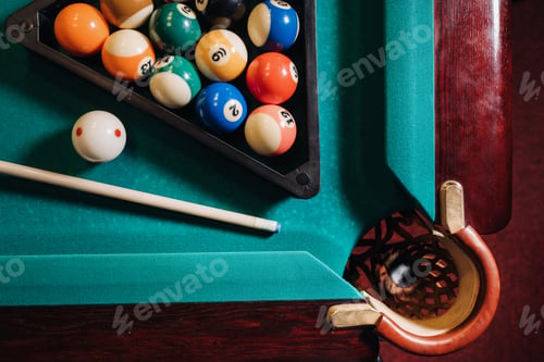 Preview: Billiard table with green surface and balls in the billiard club.Pool Game